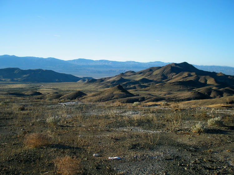 The Southern Ibex Hills are washed in sunrise glow.