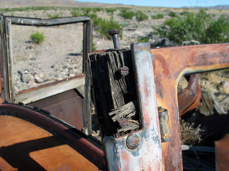 The use of wood frames tends to date this vehicle to around the 1920's.