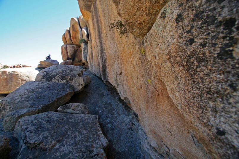 Just a quick scramble up the narrow ledge and we'll arrive at the well camouflaged shelter.