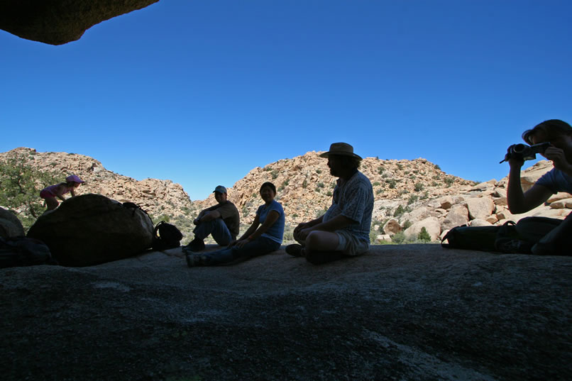 As our crew relaxes in the shadows and examines the pictographs, we notice that there is one additional panel to the right of the sunburst motif.  It consists of an arched row of 29 tally-like marks.  However, it is placed in a low recess of the rock wall and doesn't lend itself to a good photograph.