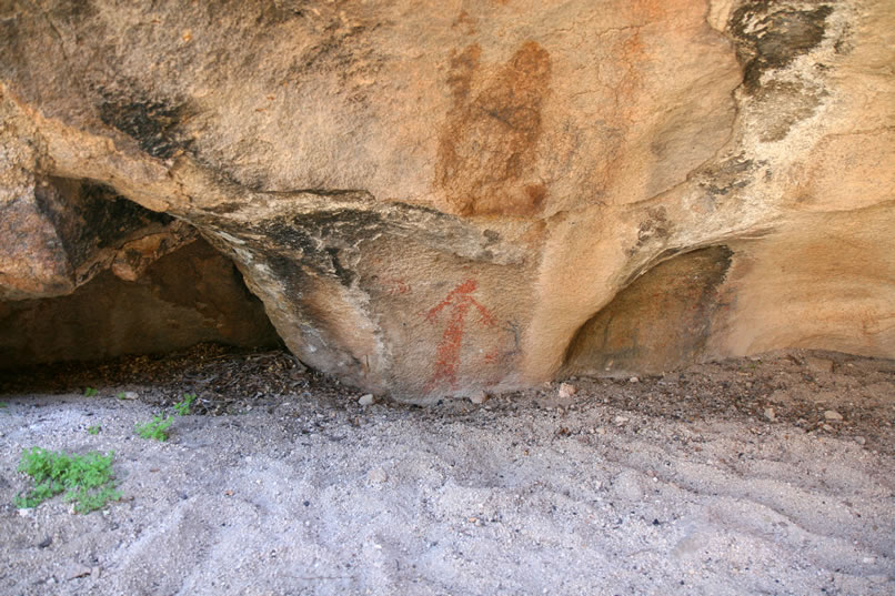 This site, CA-RIV-902, is similar to another "Red Lady" or "Painted Lady" site in Joshua Tree that also seems tied to the ancient telling of the sacred story of the "lone woman of the cave."  This metaphor for the spring solstice and the beginning of the season of fertility relates the tale that a woman, or earth mother symbol, "went out one morning to urinate and, as she spread her legs wide, the rising sun penetrated her with his rays and she became pregnant."