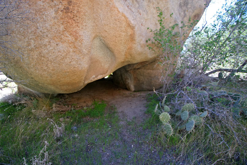 We must admit that we're pretty under whelmed when we see the tiny opening to what is supposed to be one of the most fantastic hollowed out boulders in Joshua Tree.