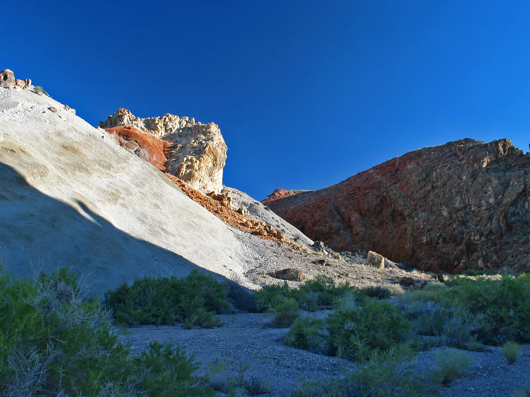 The late afternoon sun really lights up the colorful geology of the Blanco Mine area.