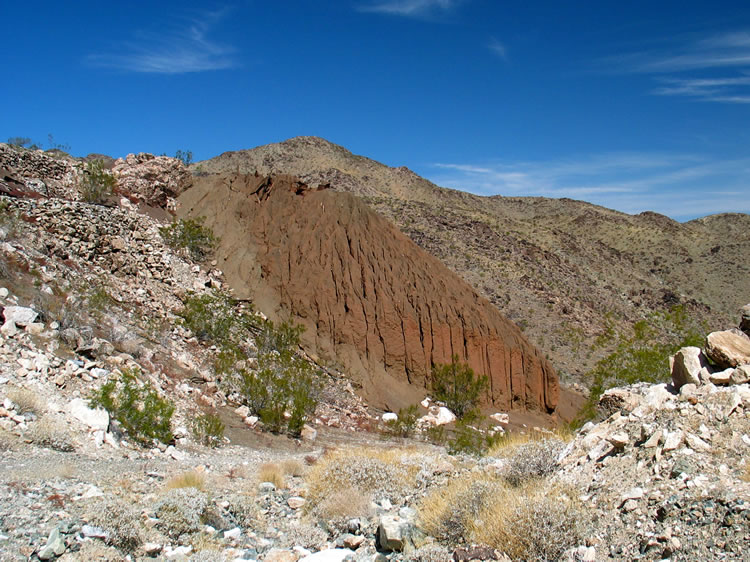 The bottom of the tailings pile.