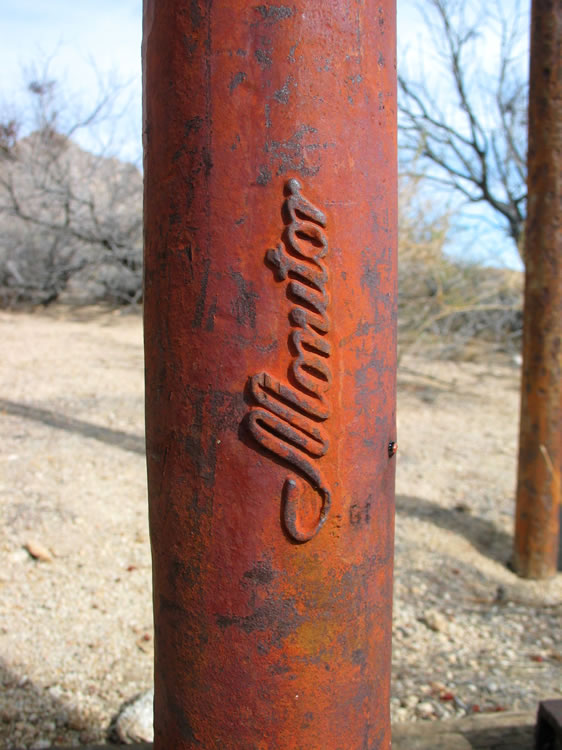 The lettering on the base of the pump.