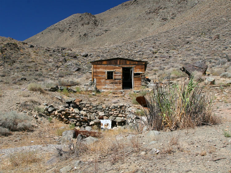 This mine was first established in the 1880's and operated until the 1940's.  The cabin that you see here probably dates from the more recent era.