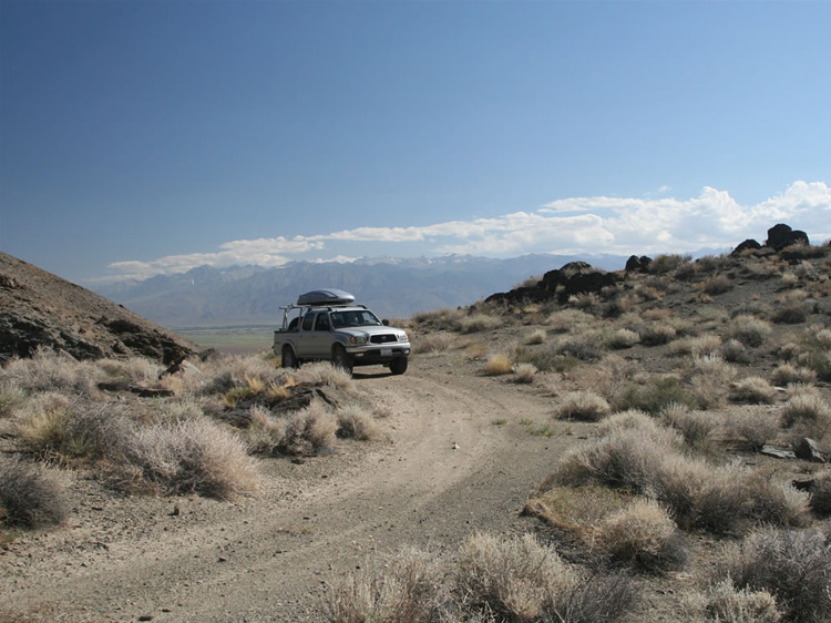 The shelf road is just wide enough for the Tacoma so we take it up to the saddle to check out the old stone foundations.
