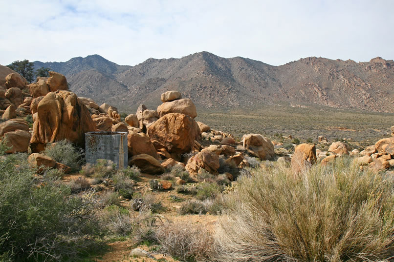 We pass a water tank tucked away above the cabin site.