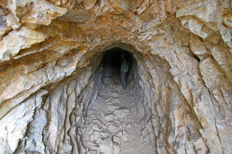 The first thing we find as we enter the tunnel are several metal bed frames.