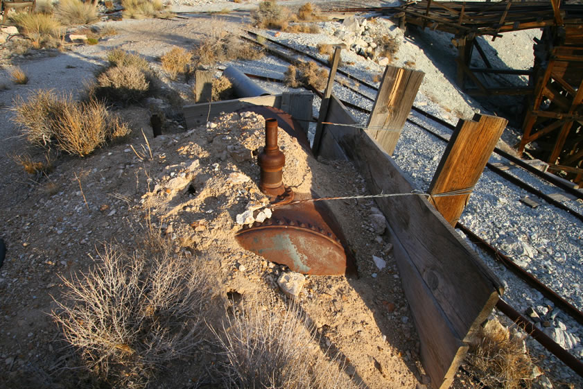 A partially buried compressor tank.