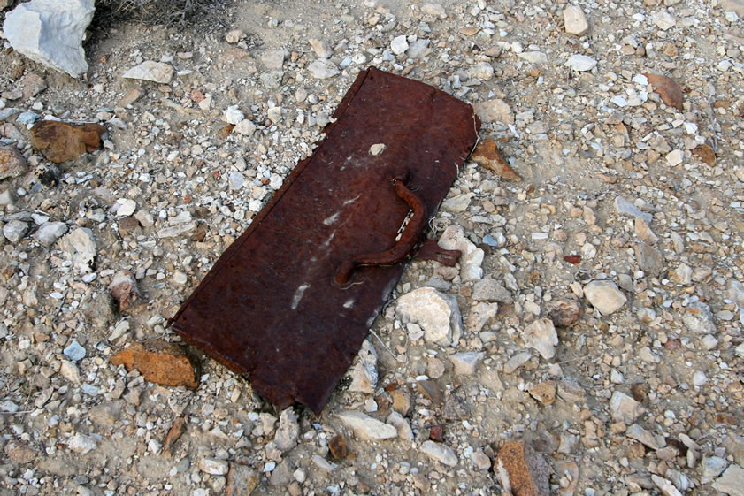 The lid to a tool box hints that this might have been a mechanic's or blacksmith's shed.