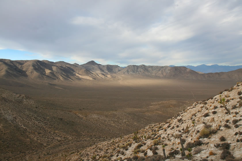 Oh, yeah!  Remember Niki?  When last seen she was climbing up to the saddle above the mine.  Here's a view from her location looking down at Ulida Flat.