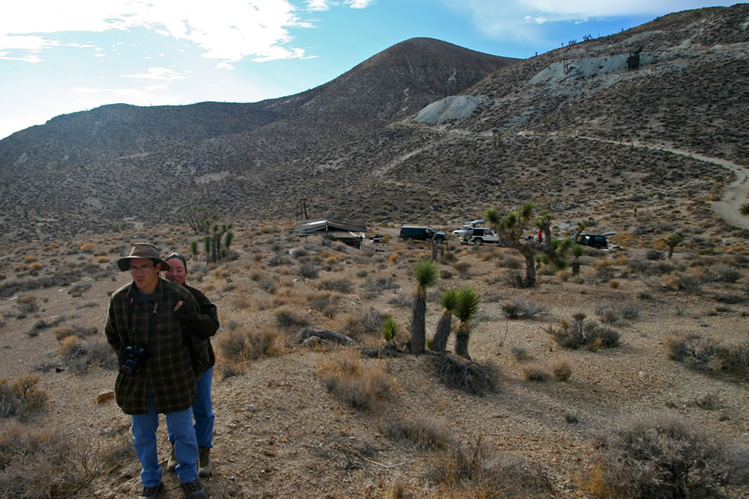 While Niki's on her way down, Guy and Alysia point out the partially buried water tank that they've found up behind the cabin.