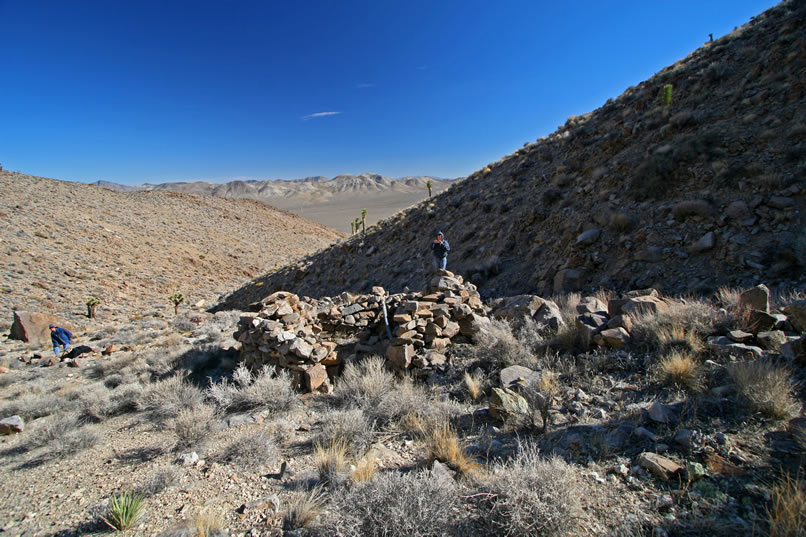 On a little flat below the mine adit we find a stone foundation and an old furnace.  Here we're looking at the stacked stone foundation which appears to have been used as a cabin.