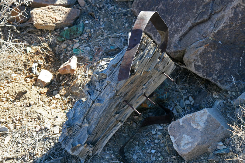 Near the furnace are the remains of an anvil stump with the strap in place.  Lots of slag is strewn around the furnace site.