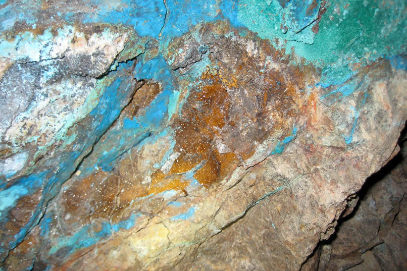 The brownish rock sparkling in the center of the photo is covered in a druzy coating that really stands out when light is shone on it.