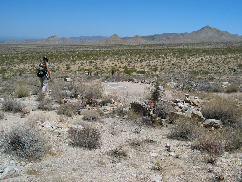 On our way down to it we come across the ruins of another structure.  Here Niki approaches the concrete floor which has an 